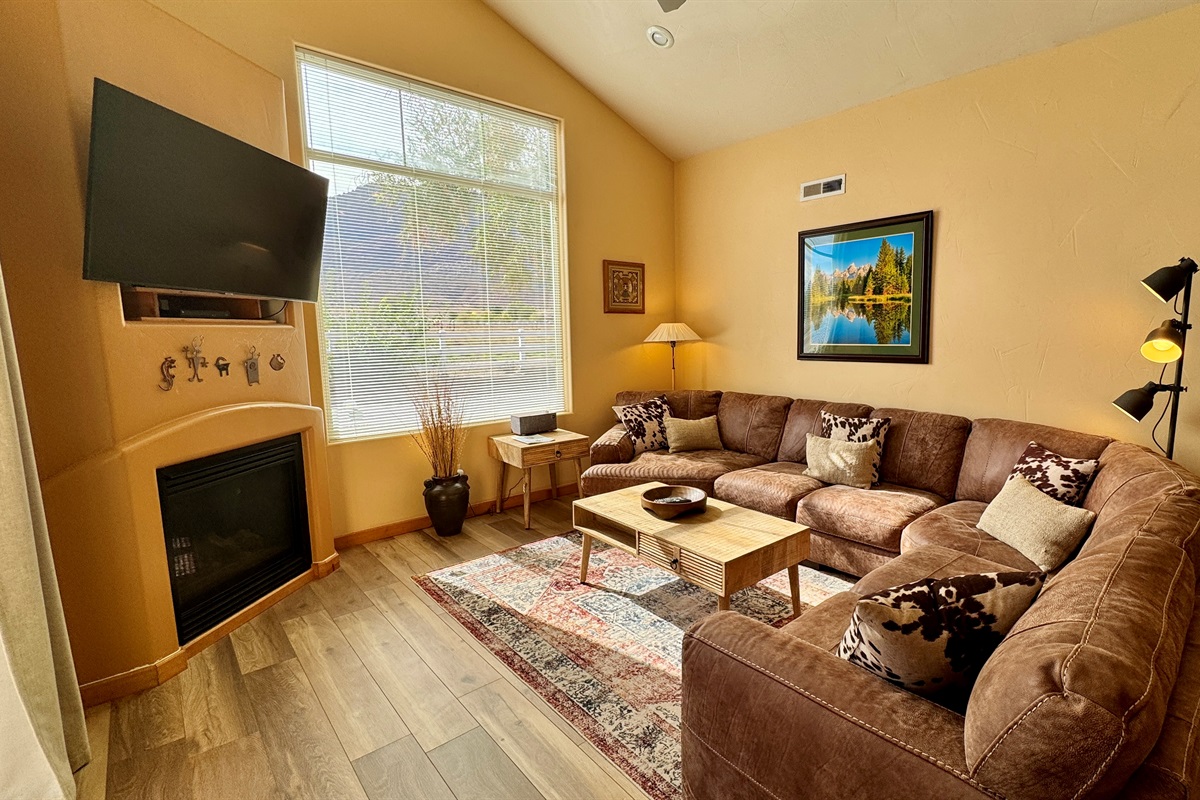 Spacious living area with large leather sectional and huge views!