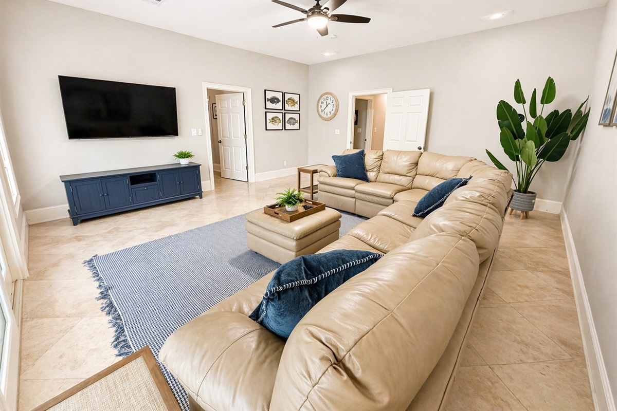Comfortable second living area with a large sectional and big-screen TV—perfect for movie nights or relaxing after a day on the lake.