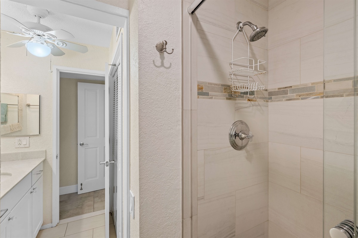 The set up allows one person to shower in privacy and another person to get ready.