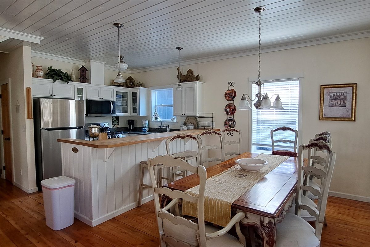 Gather around the French-Country table for 8, with additional seating at the kitchen island for family and friends.