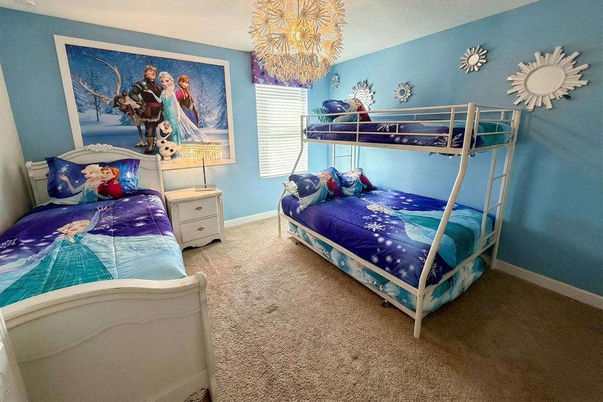 Bedroom 7 - The Frozen themed room is fit for a princess w/ 1 twin & a twin over full bunk bed with a trundle bed