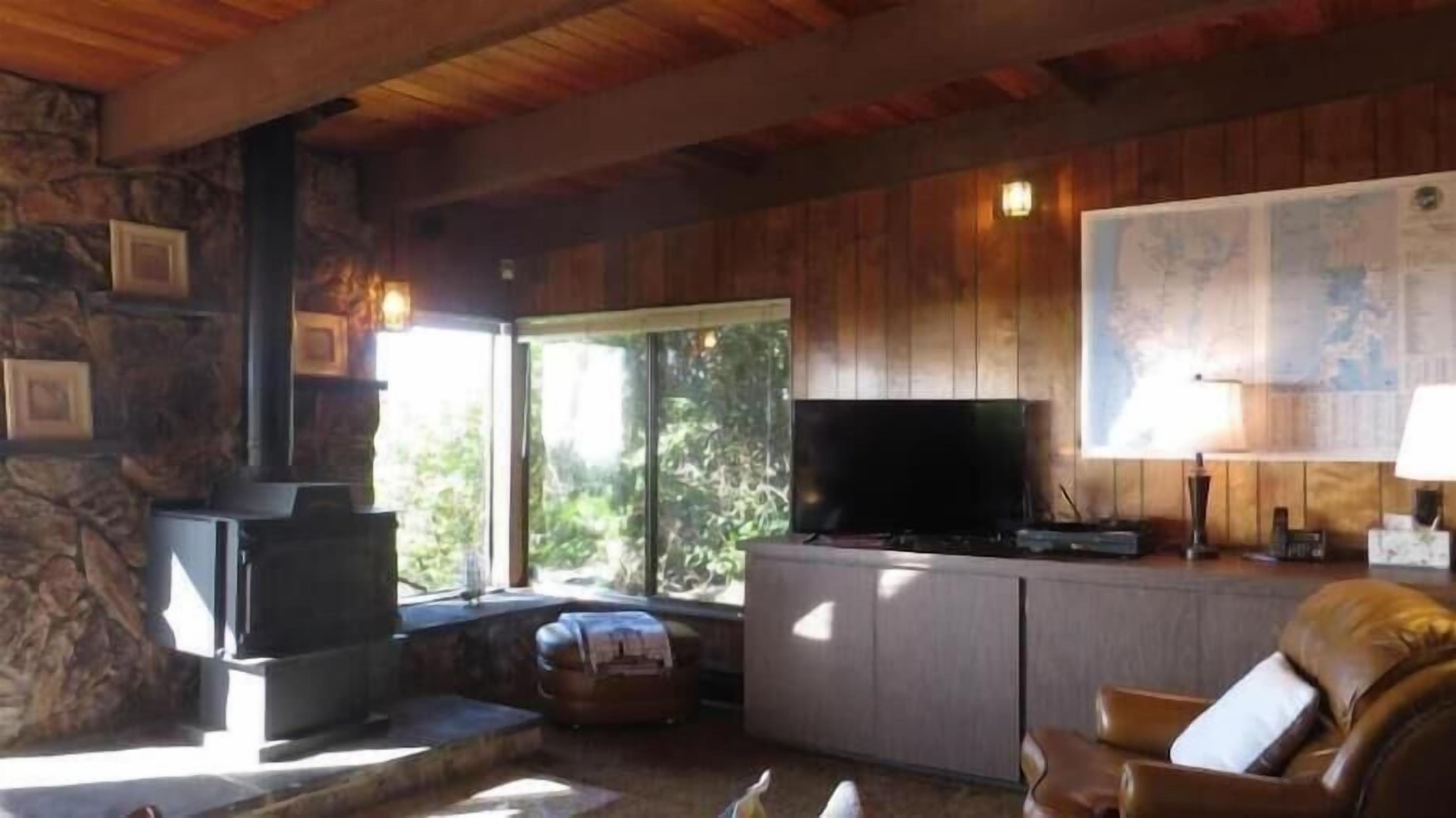 Living Room with wood stove & Tv