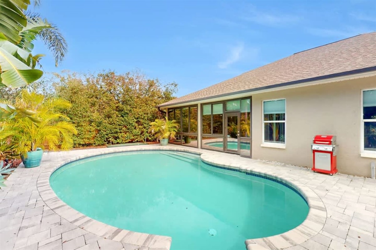Sunlit backyard pool calling for all-day lounging.