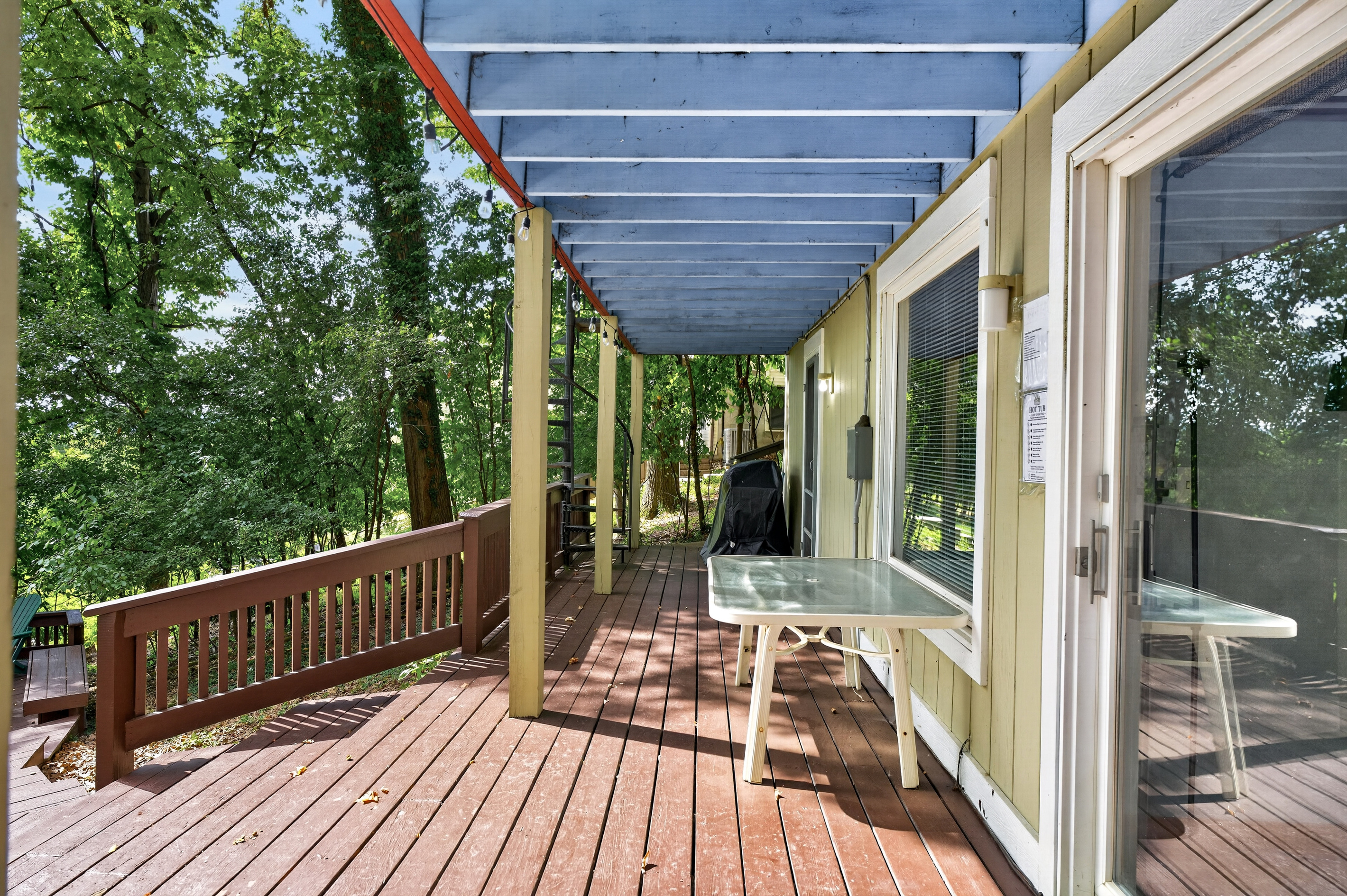 Wooden deck beside large windows
