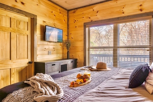 Sink into the luxurious king size bed overlooking the balcony.