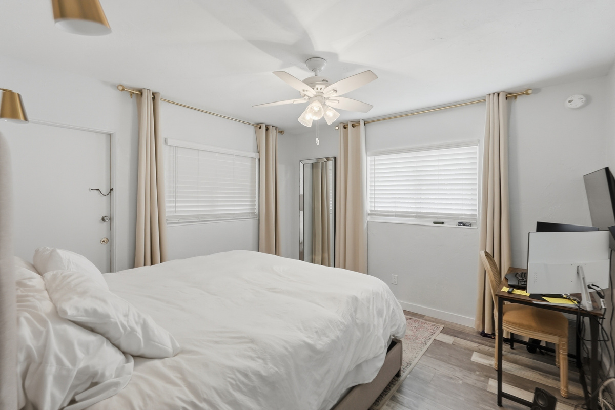 Unwind in the comfort of the primary bedroom, offering a peaceful retreat where you can recharge after a sunny day exploring St. Pete Beach.