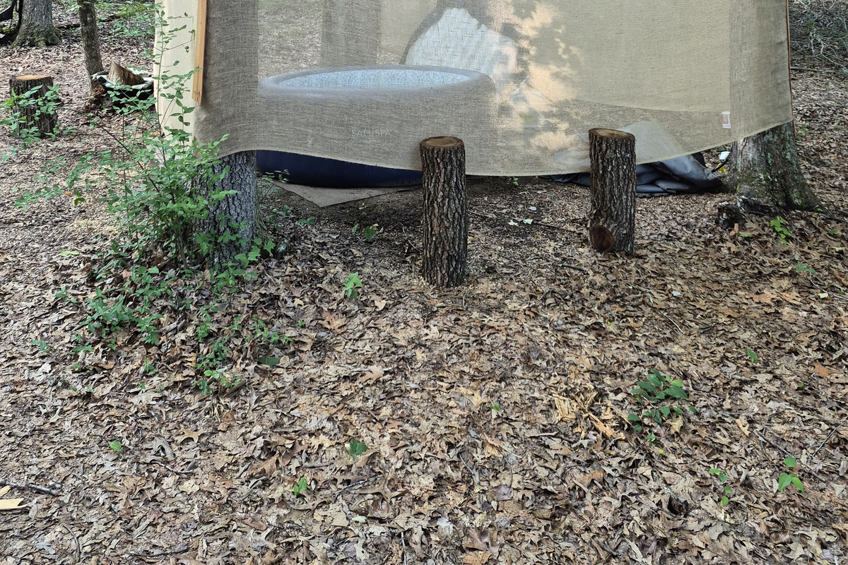 Looking behind the hot tub with Driftwood in the background