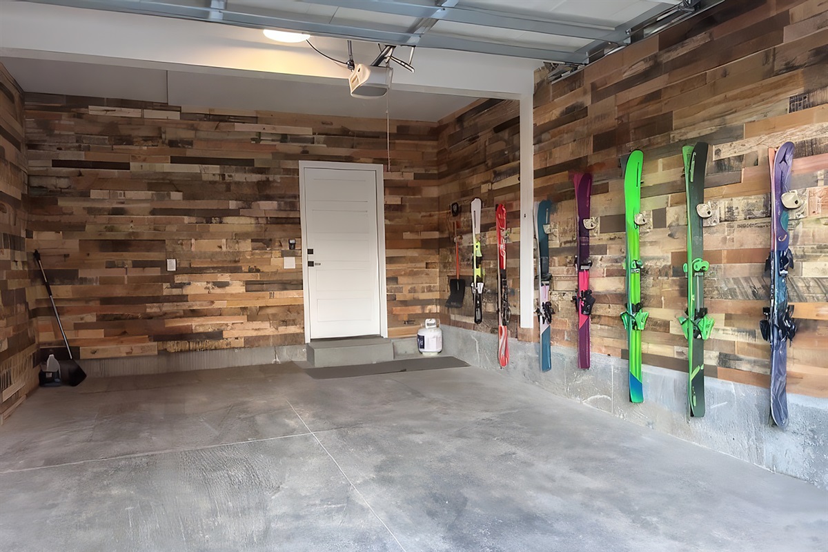 Secure your gear on this custom rustic wood ski wall.
