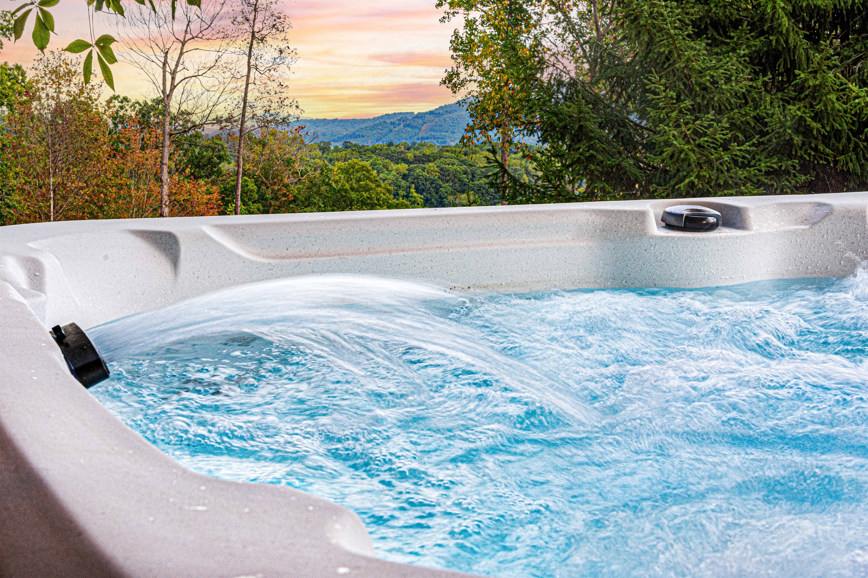 Relax in our inviting hot tub with a peek-a-boo view! Soak in the comfort while enjoying the stunning surroundings. This perfect spot combines relaxation with breathtaking scenery, making it an ideal retreat for unwinding and soaking in nature’s beauty!