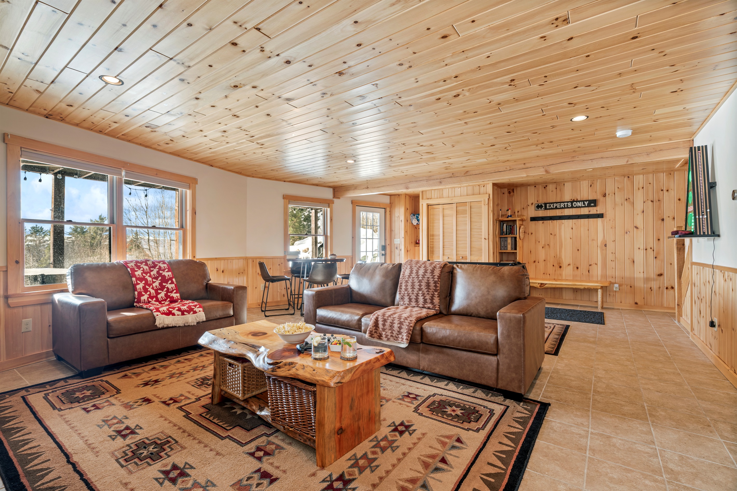 Lounge in comfort with extra space and a handy fridge nearby.