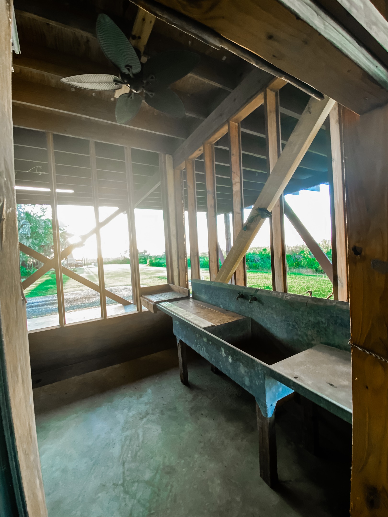 Fish cleaning area downstairs with working sink.