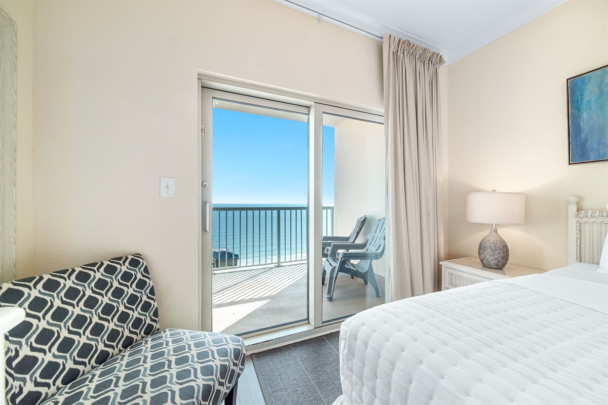 Step out onto your private balcony and enjoy the fresh sea air. This primary bedroom features a comfortable king-szie bed and a flat-screen TV for your enjoyment.