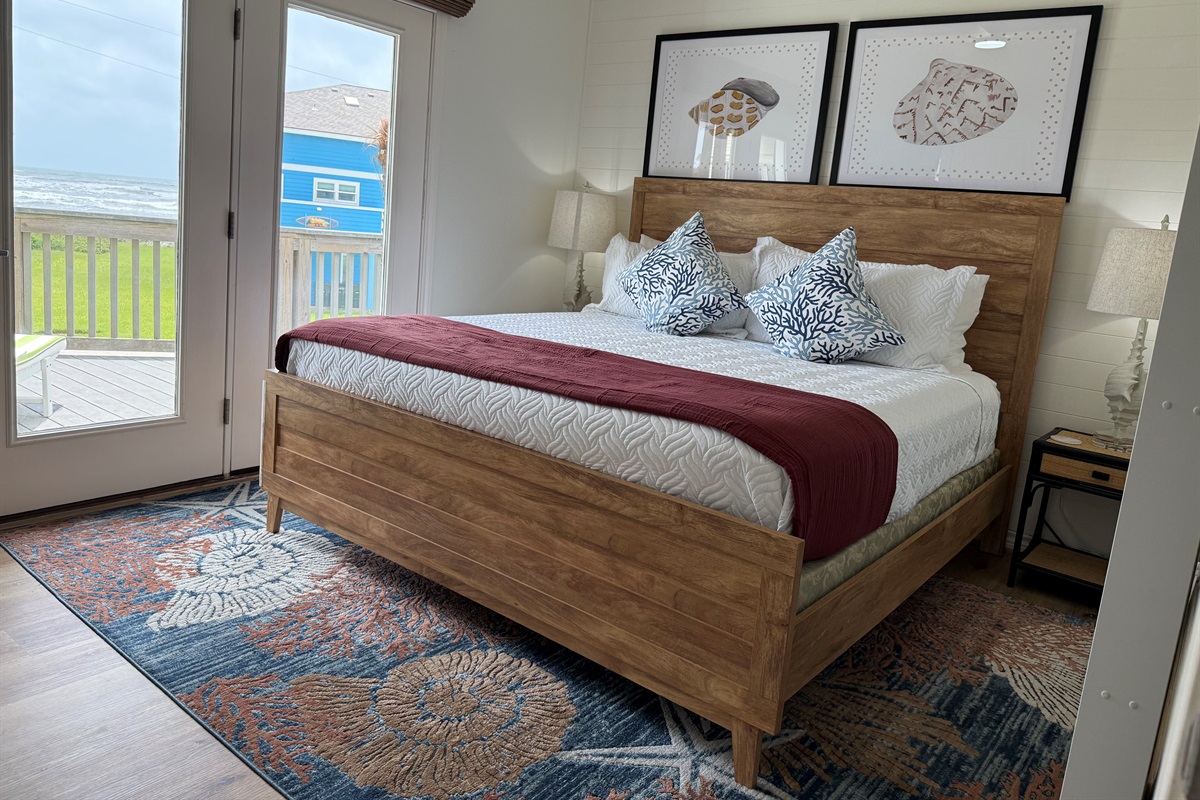 The Shell primary suite on the main level has access to the deck, and views for miles of the Gulf. The roller shades are remote controlled and black out for privacy. 