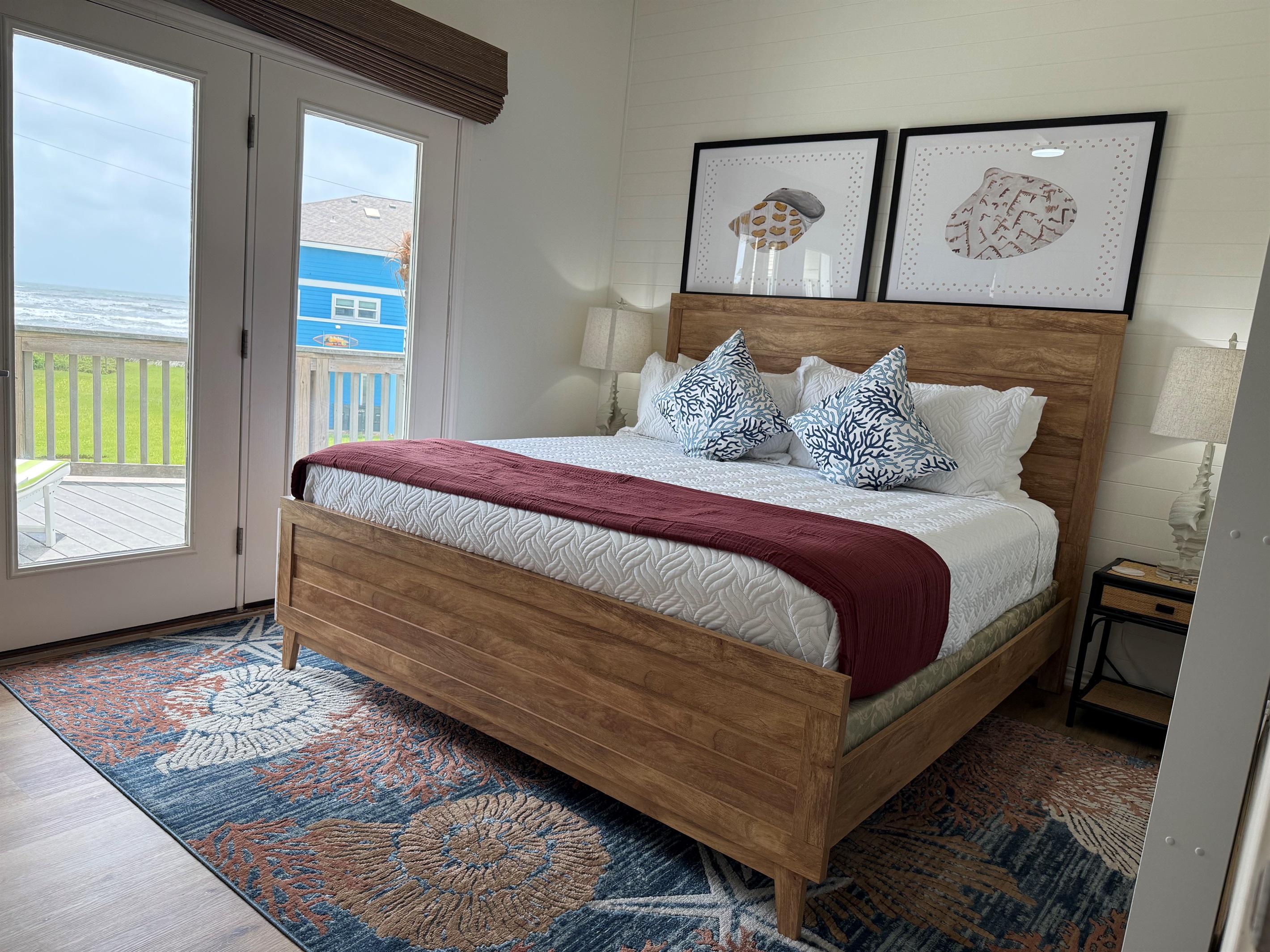 The Shell primary suite on the main level has access to the deck, and views for miles of the Gulf. The roller shades are remote controlled and black out for privacy. 