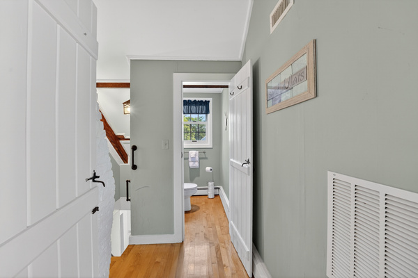 Bright upstairs hallway providing easy access to the loft, bedrooms, and full bathroom.