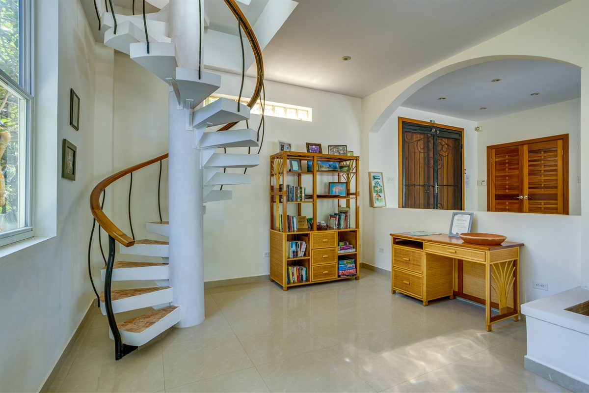 Spiral stair case to second floor bedroom area and office space
