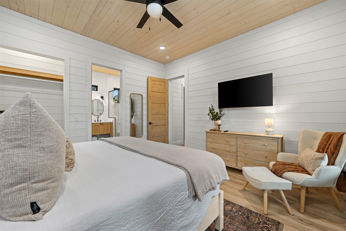 View of bedroom suite #1 with view of entrance to private bath