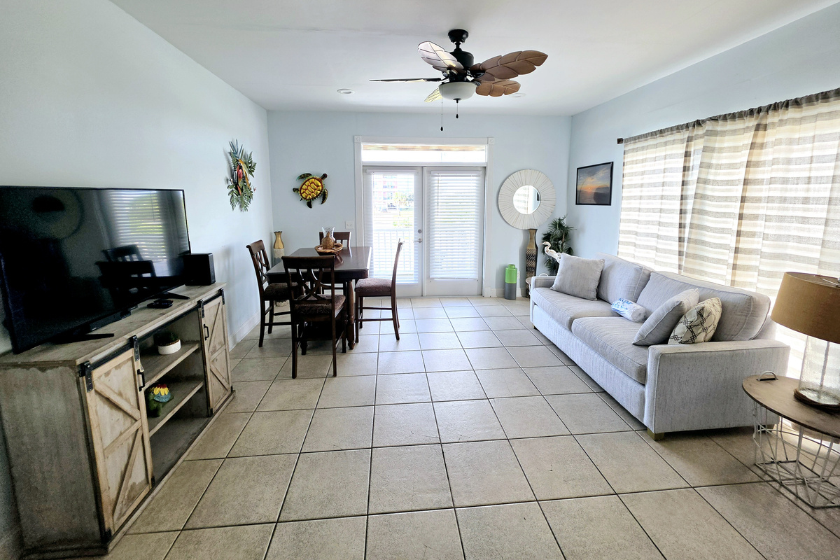 Open living and dining area with TV and sofa