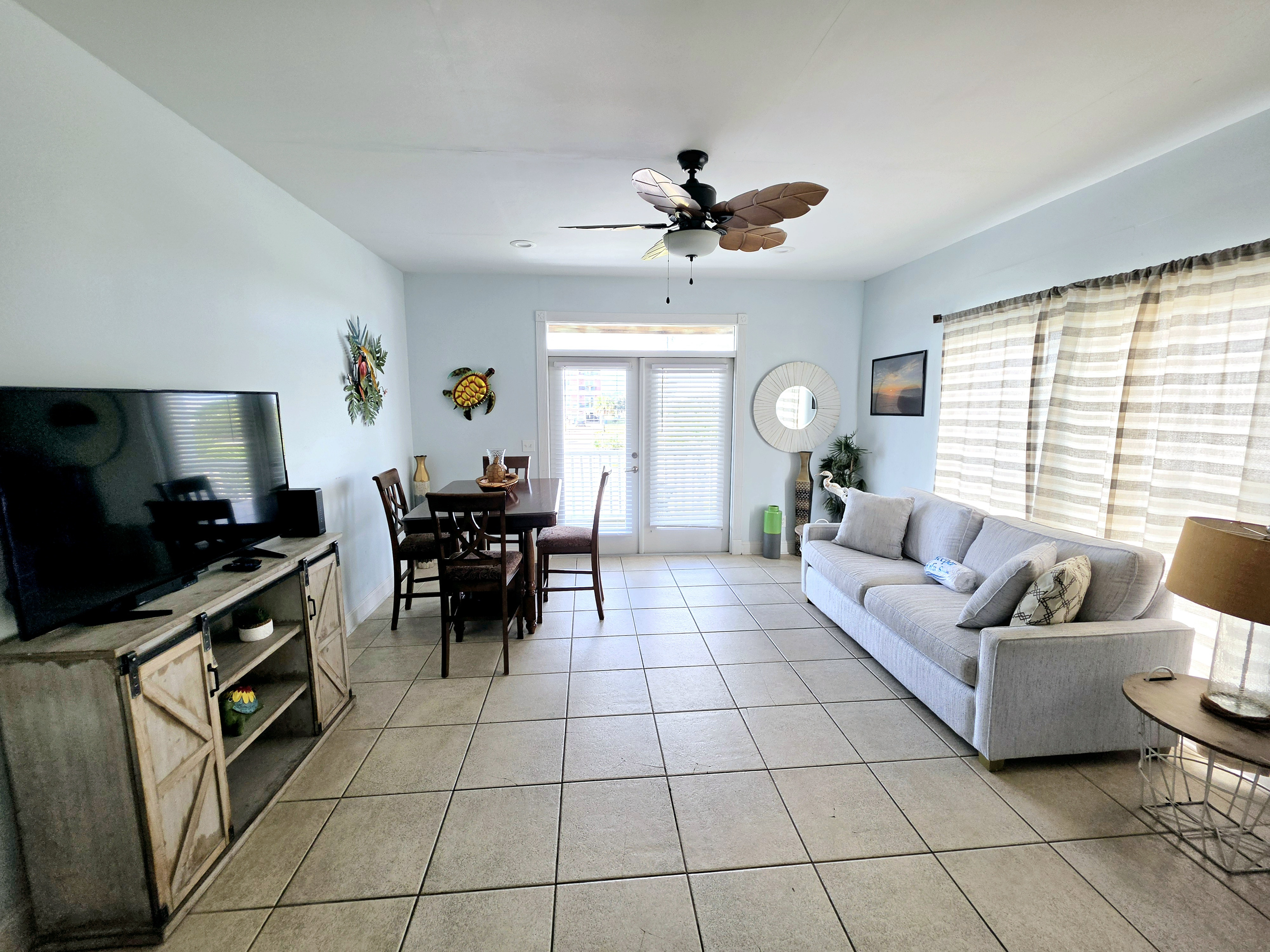 Open living and dining area with TV and sofa