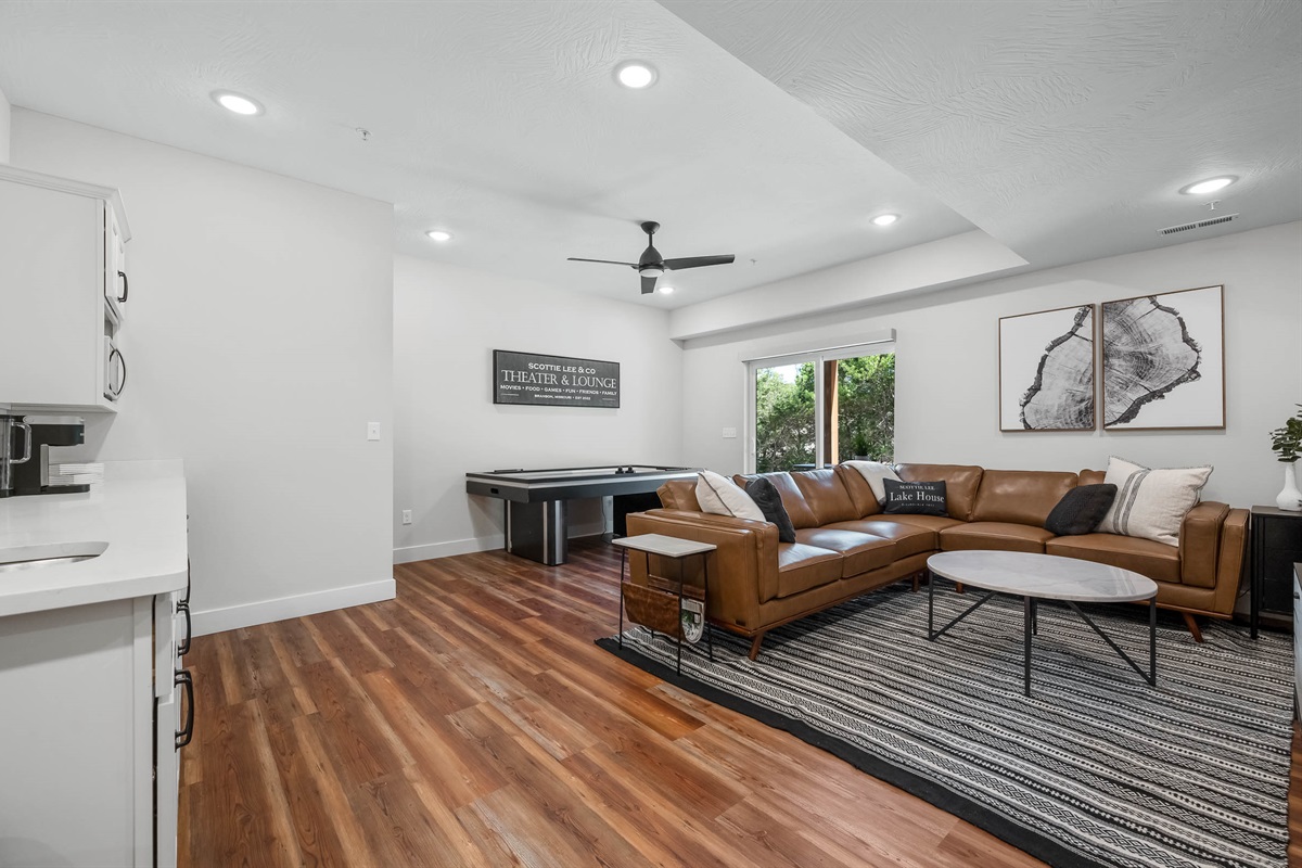 Lower living, wetbar, and air hockey table