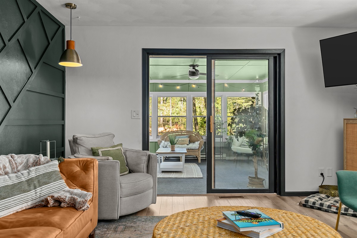 A sliding door from the living room leads directly into the sunroom