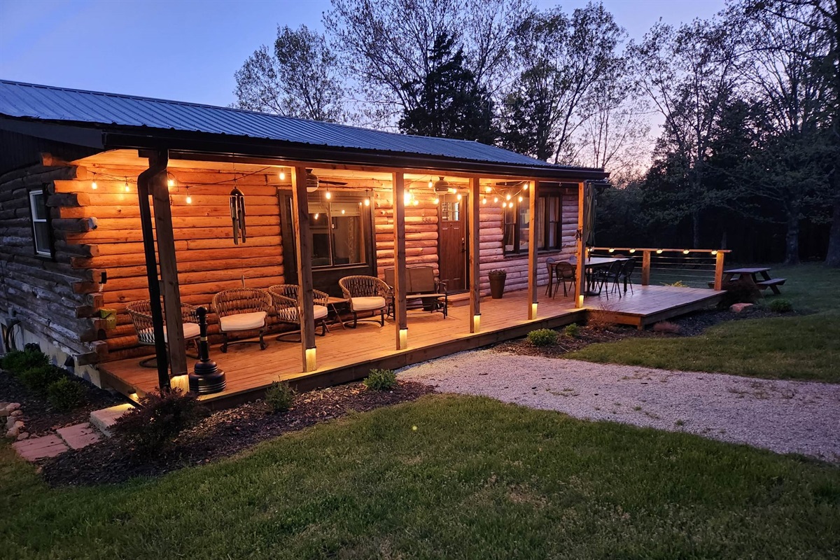 The front porch comes alive at night with glowing string lights&mdash;creating a fun, inviting space to relax and enjoy the evening.