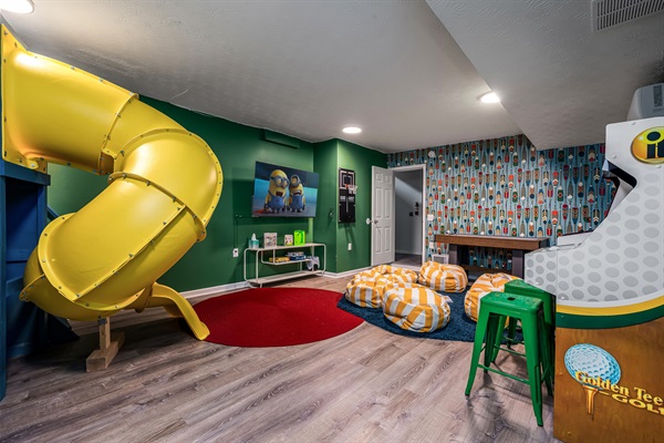 The ultimate kids’ zone—slide, movies, arcade games, and space to play for hours. Good luck getting them to leave!