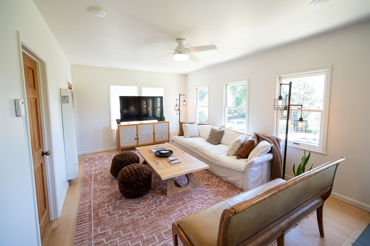 Bright and comfortable living space designed for relaxing after a day in Napa. Smart TV and large sofa couch and bench. Board games included for a night in. 