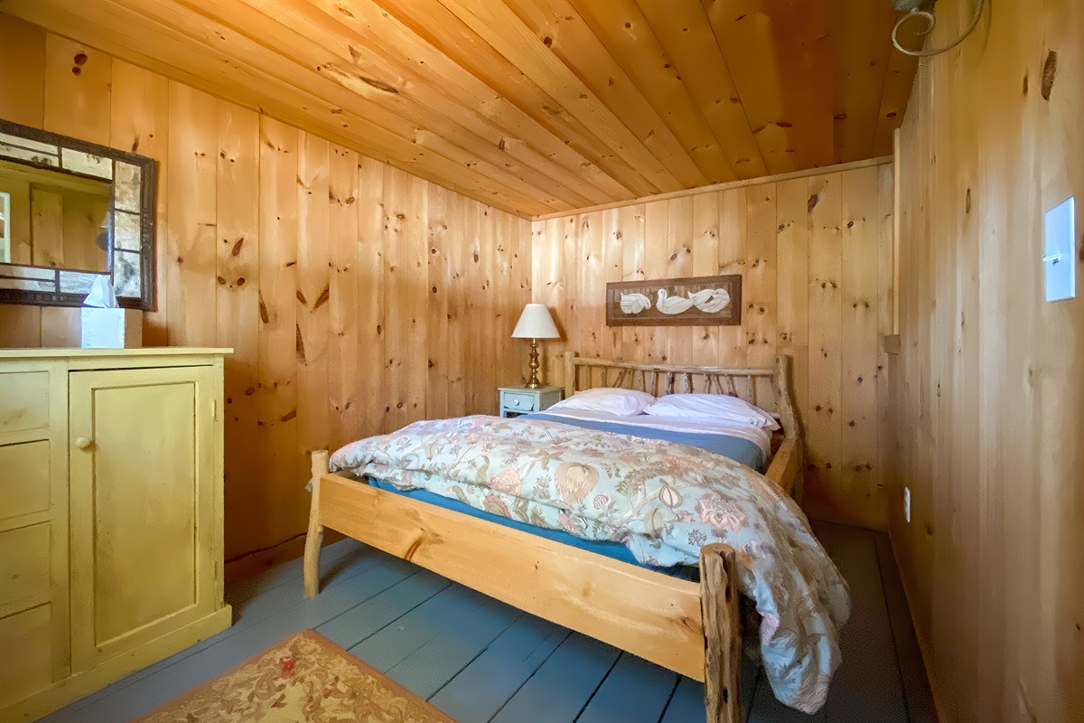 Third bedroom. We call this the Pine Room, and the bed is handmade by a renowned furniture maker. We've added some more art, too, come check it out.