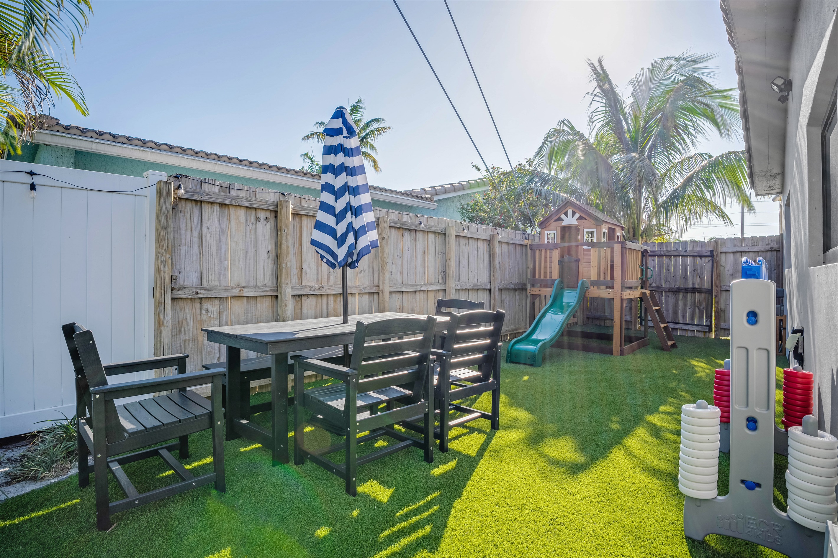 Don't worry about entertaining the kids, relax at the shaded table while they play nearby