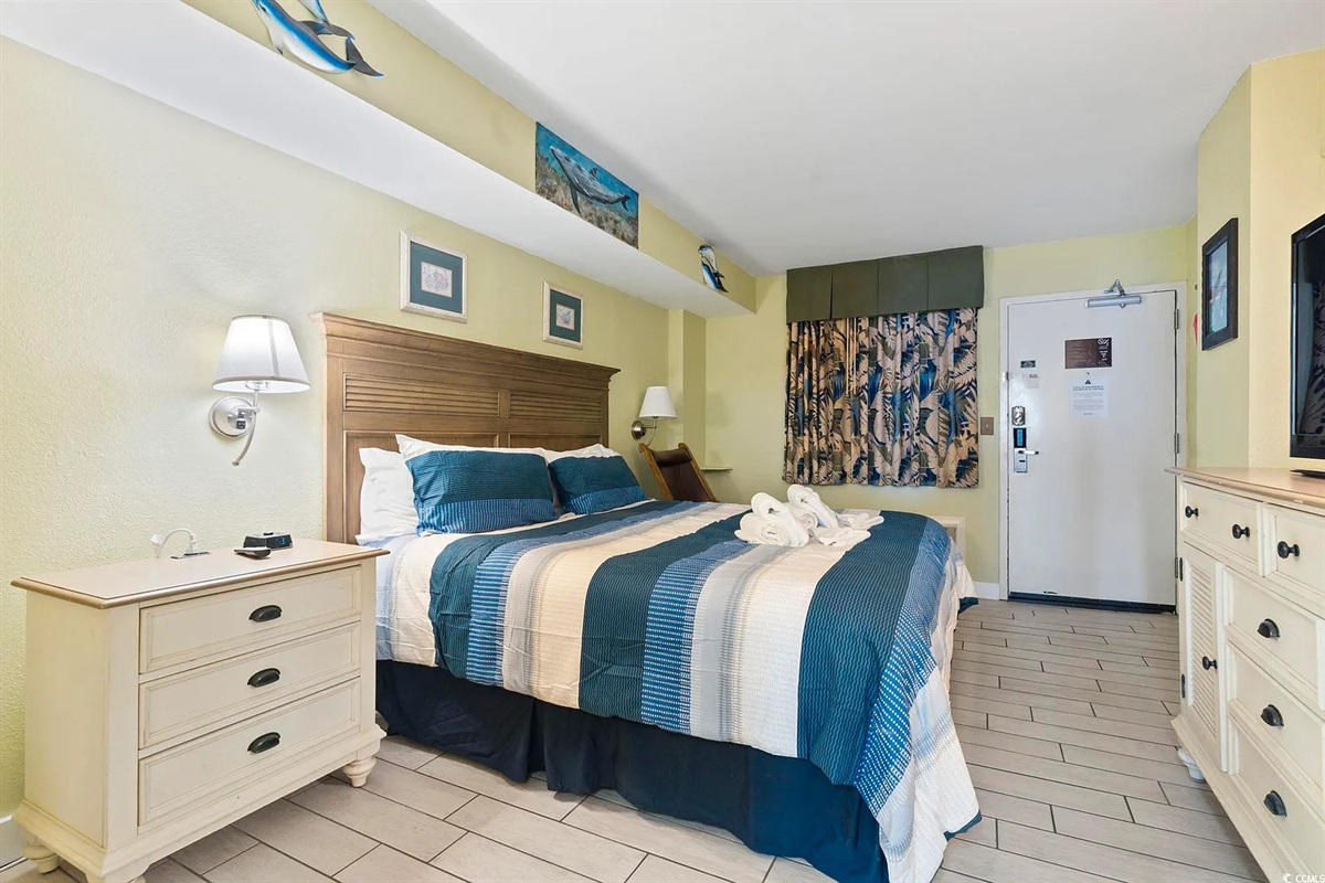 Relax in comfort with soft linens and a calm coastal vibe