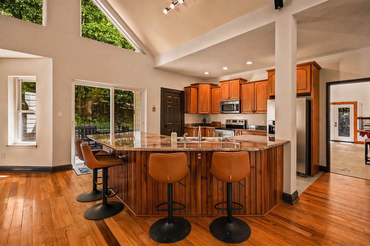 Fully stocked kitchen complete with a beautiful island with additional seating for 4.