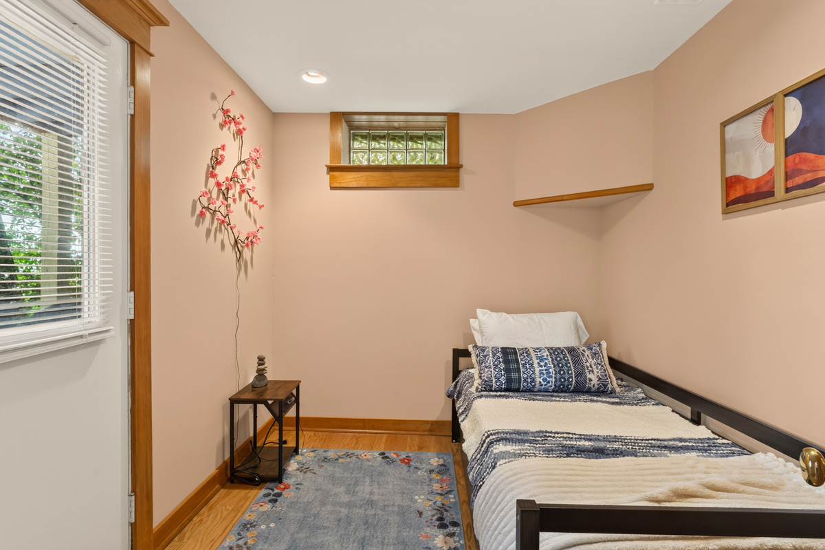 Small bedroom with window and nightstand