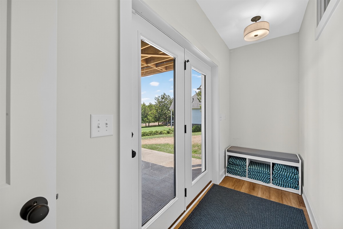 Convenient lakeside entry with bench seating and cubbies—perfect for dropping towels, shoes, and lake gear.