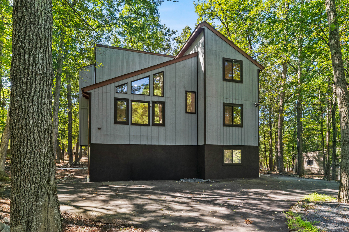A modern mountain design with an abundance of large windows that let in beautiful views