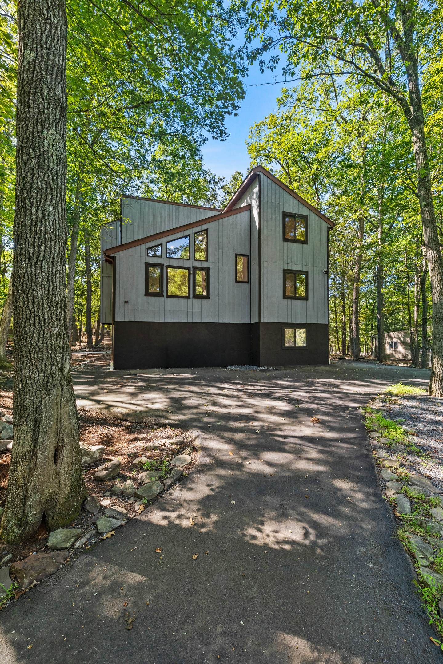 A modern mountain design with an abundance of large windows that let in beautiful views