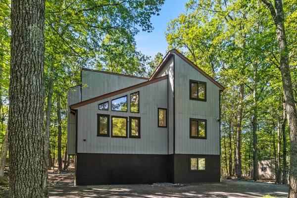 A modern mountain design with an abundance of large windows that let in beautiful views
