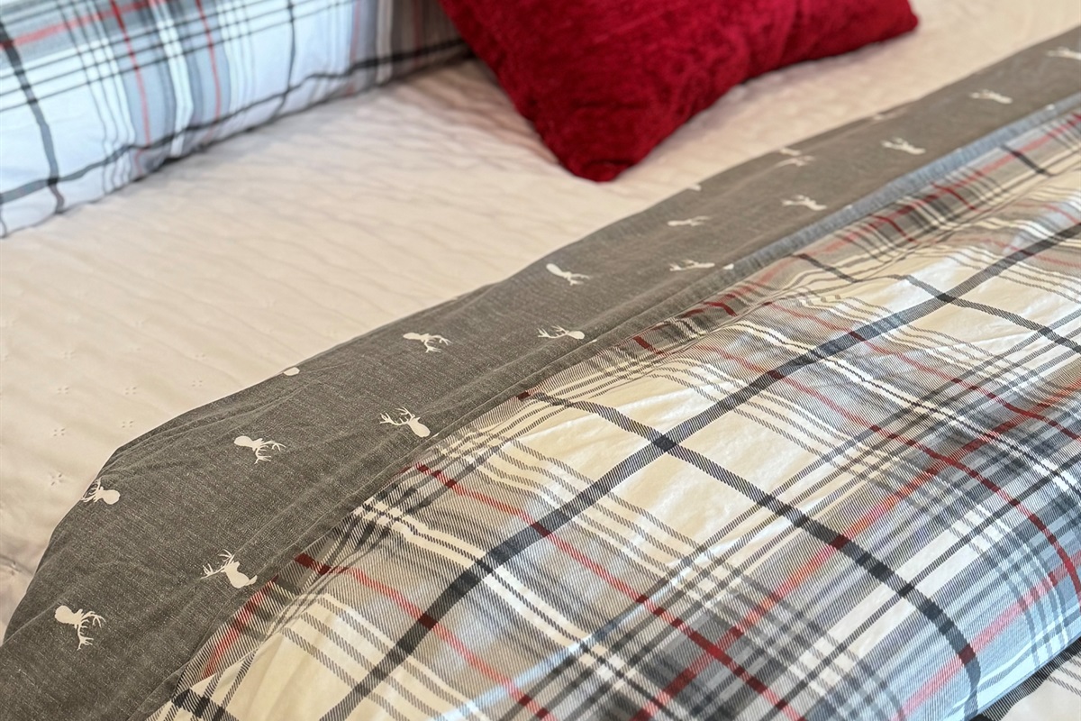 Lowe level Primary Bedroom has holiday sheets