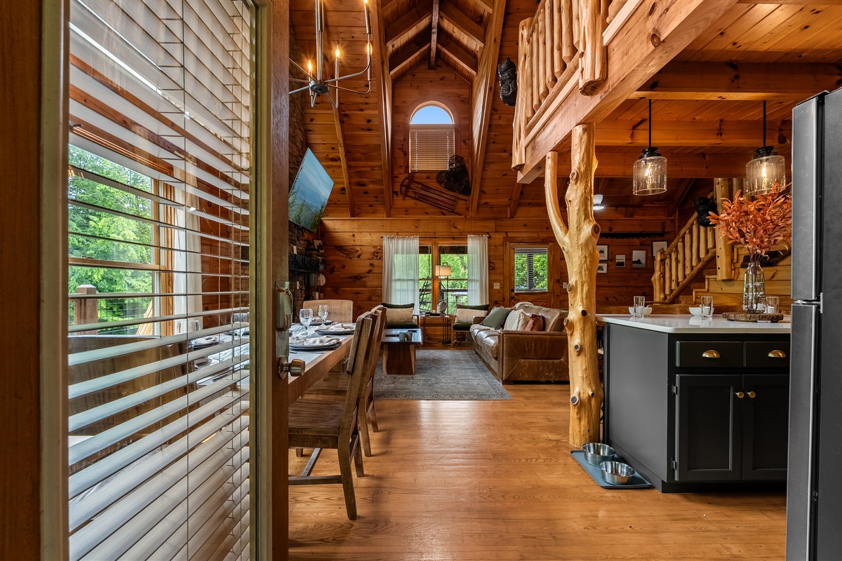 Step inside and immediately feel the warmth of this beautifully refreshed log cabin, featuring soaring vaulted ceilings, an open-concept living space, rustic wood finishes, and thoughtful family- and pet-friendly touches throughout.