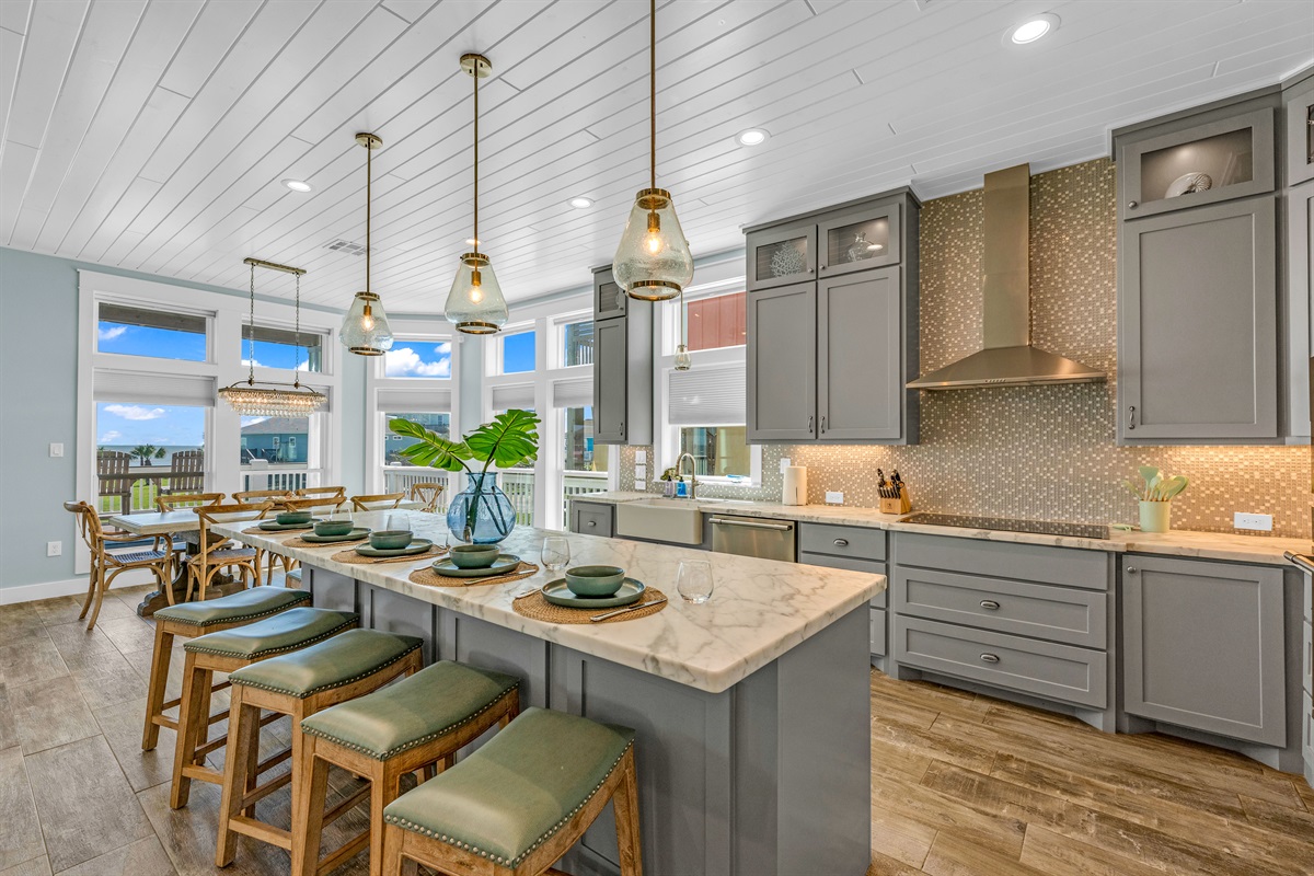 Crystal Paradise Kitchen: An inviting kitchen bathed in light, boasting marble surfaces and generous space for friends and family.
