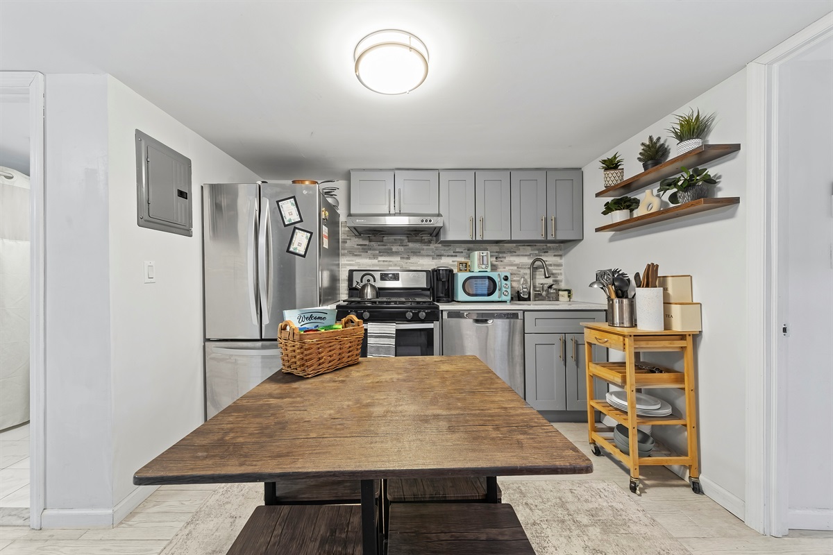 Cook with ease, share meals, and linger longer in this fully equipped kitchen designed for both quick bites and cozy dinners.