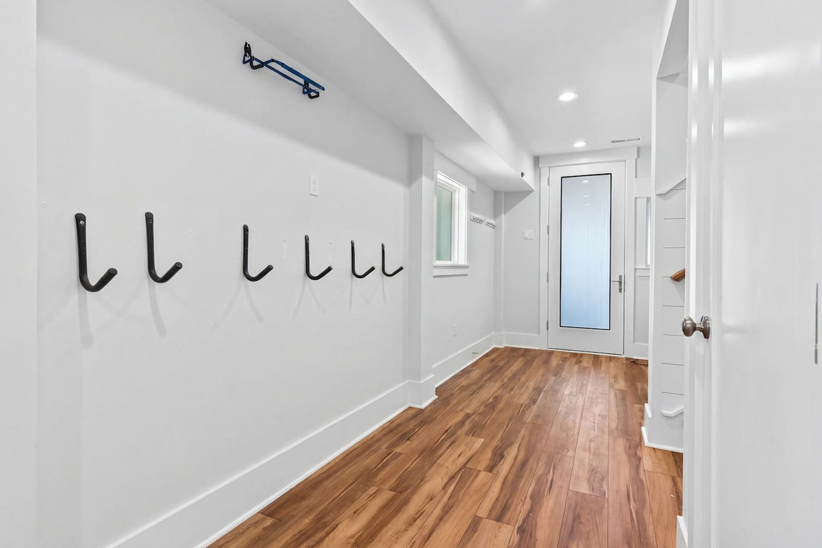 The ground floor entry area is stocked with all the essentials you need for a day by the ocean, including beach chairs, towels, a cooler, 2 wagons, 2 umbrellas, and a Shibumi Shade—so you can spend less time packing and more time enjoying the beach.