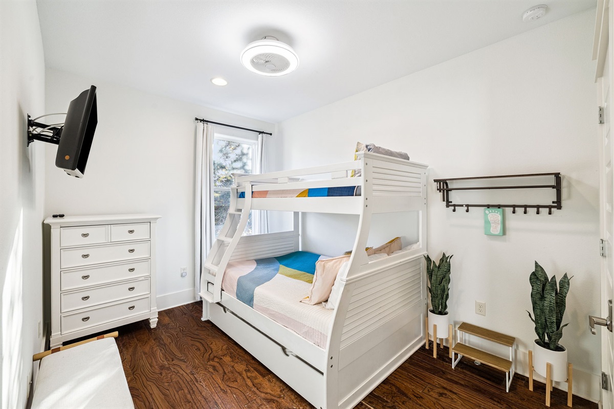 Perfect for the little ones, the bunk bedroom upstairs has its own smart TV and ensuite bathroom.