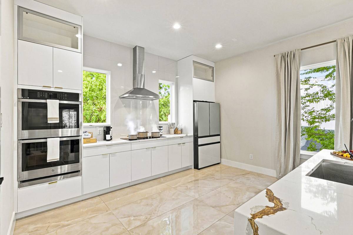 Sleek design with premium appliances and sunlit views for culinary adventures!