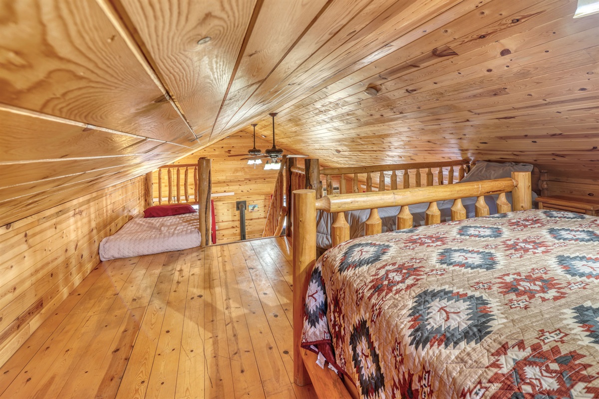 Loft area with 1 Queen bed and 2 twin beds