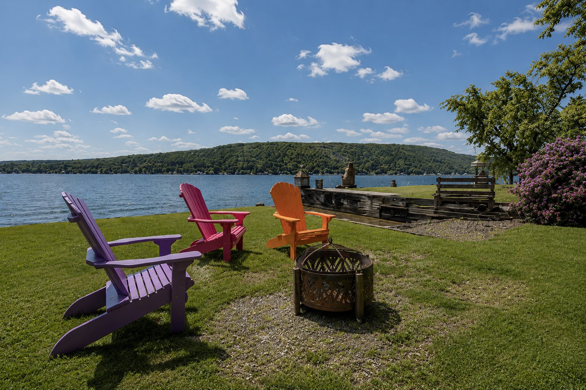 Gather around the fire with colorful Adirondack chairs and a covered seating area 🔥🪑🎨