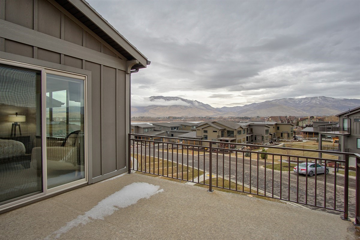 Step onto a private deck from the bedroom and take in sweeping valley and mountain vistas—an effortless extension of indoor comfort.