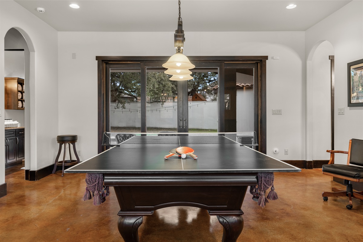 Where fun meets style – the ultimate adult game room, complete with a bar, pool table, poker table, and media room for endless entertainment.