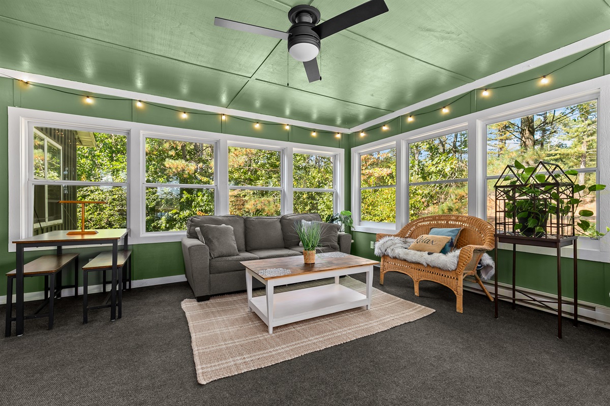 Guests enjoy the sofa sleeper in the sunroom, which provides extra sleeping space when needed
