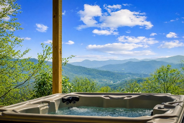 Soak in the hot tub as mountain views stretch out in front of you—perfect for unwinding after a day of exploring.